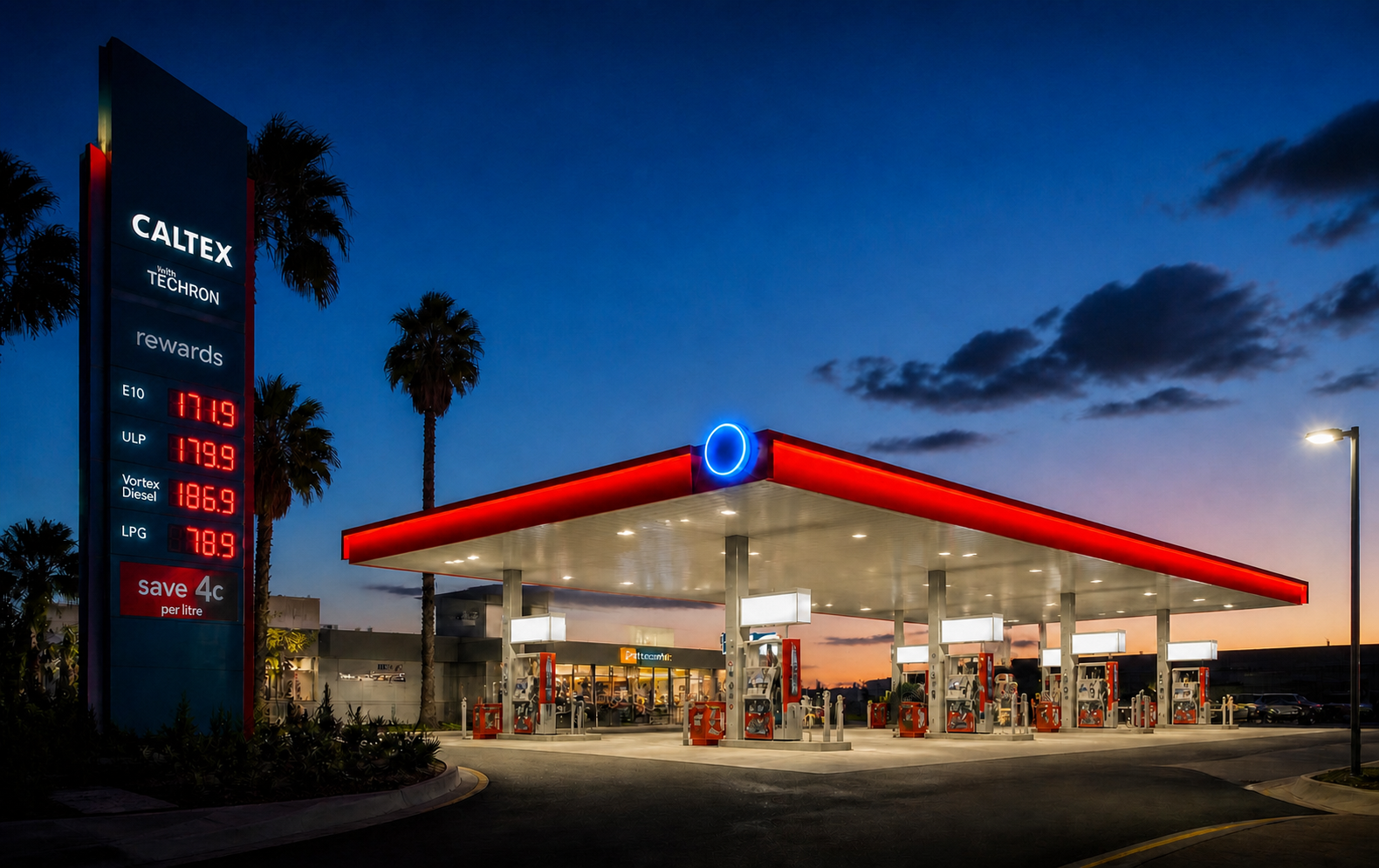 Posto de combustível iluminado ao entardecer